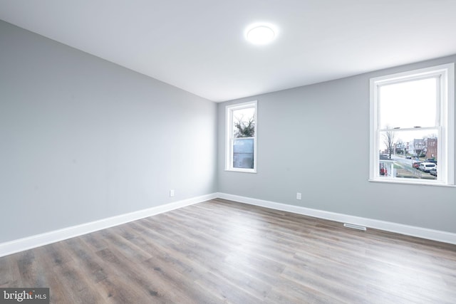 spare room featuring hardwood / wood-style floors