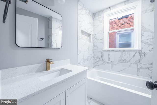 bathroom featuring vanity and tiled shower / bath combo