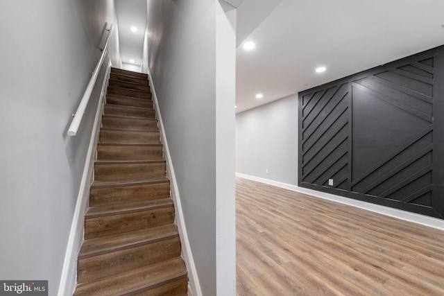 stairway featuring hardwood / wood-style floors