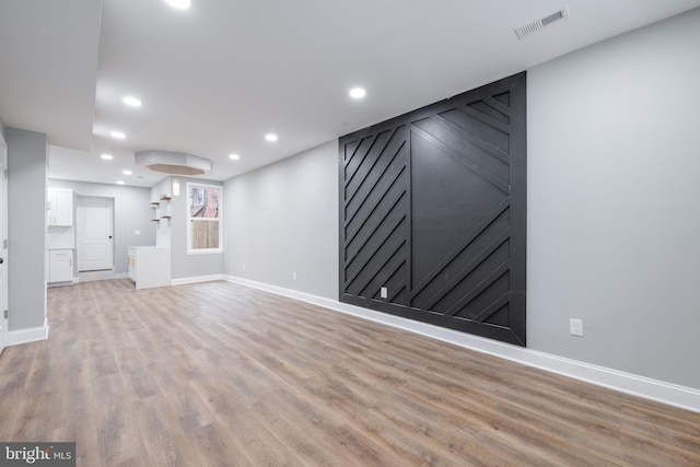 unfurnished living room featuring light hardwood / wood-style flooring