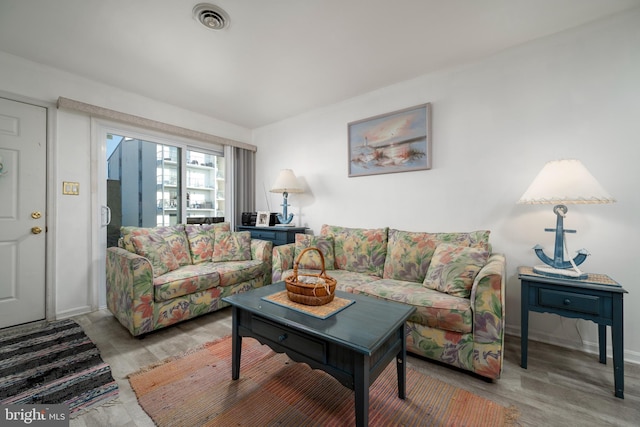 living room with light hardwood / wood-style floors