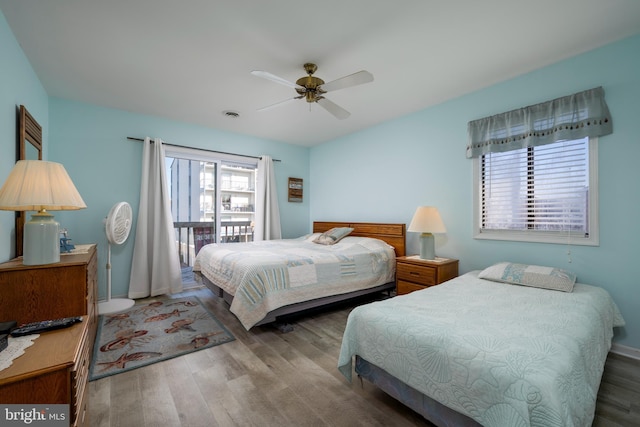 bedroom with ceiling fan and wood-type flooring