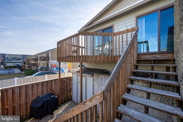 wooden deck featuring a grill