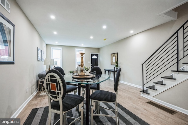 dining room with light hardwood / wood-style flooring