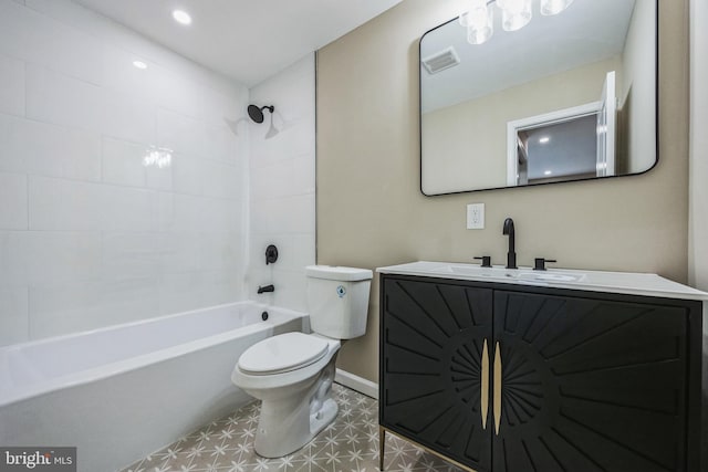 full bathroom featuring tile patterned flooring, tiled shower / bath combo, toilet, and vanity