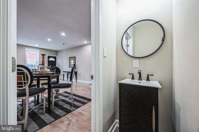 interior space with hardwood / wood-style floors and vanity