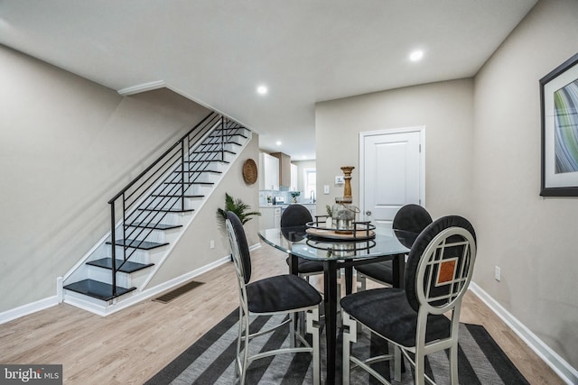 dining room with light hardwood / wood-style floors