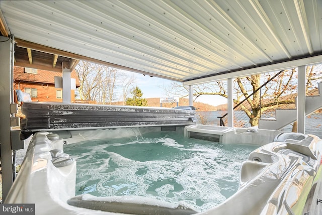 exterior space with a hot tub