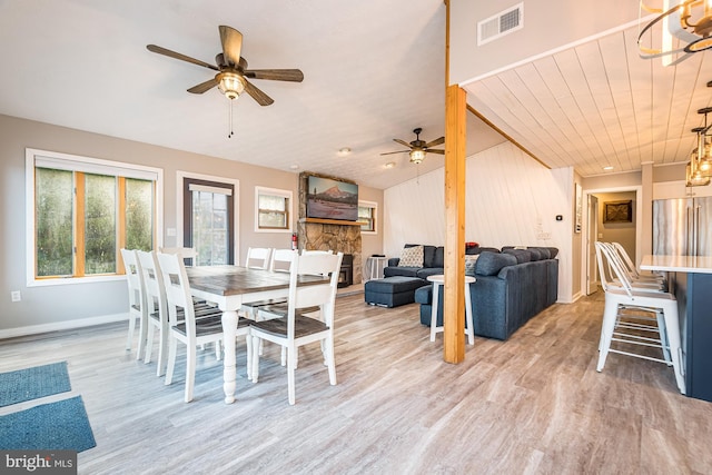 dining room with hardwood / wood-style flooring, ceiling fan, and wooden ceiling