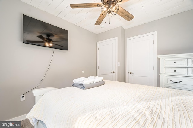 bedroom with wood-type flooring and ceiling fan