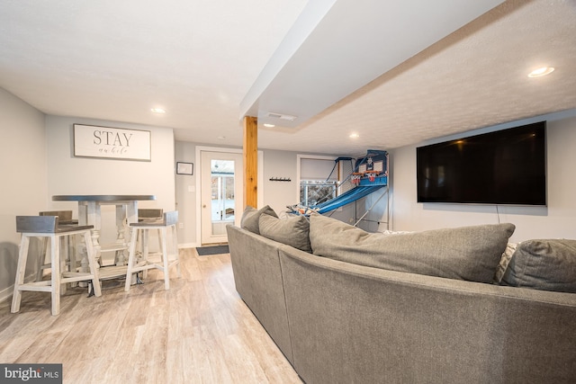 living room featuring hardwood / wood-style floors and a textured ceiling