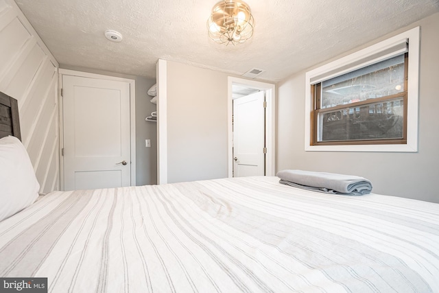 bedroom featuring a textured ceiling