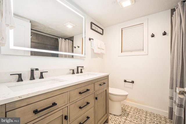 bathroom with tile patterned flooring, vanity, toilet, and a shower with shower curtain