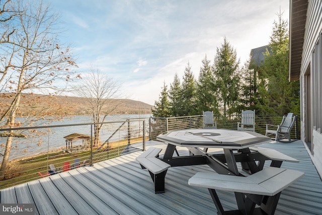 wooden terrace with a water view