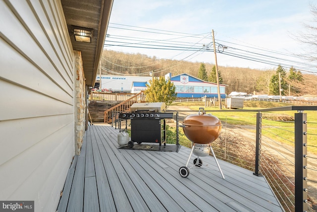 wooden deck with grilling area