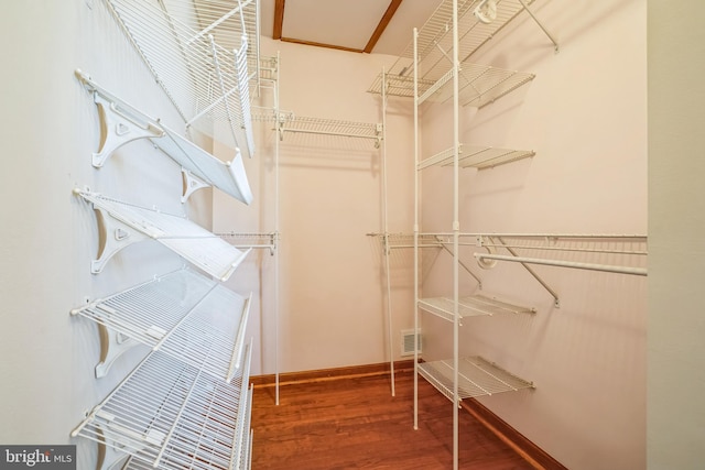 walk in closet featuring hardwood / wood-style flooring