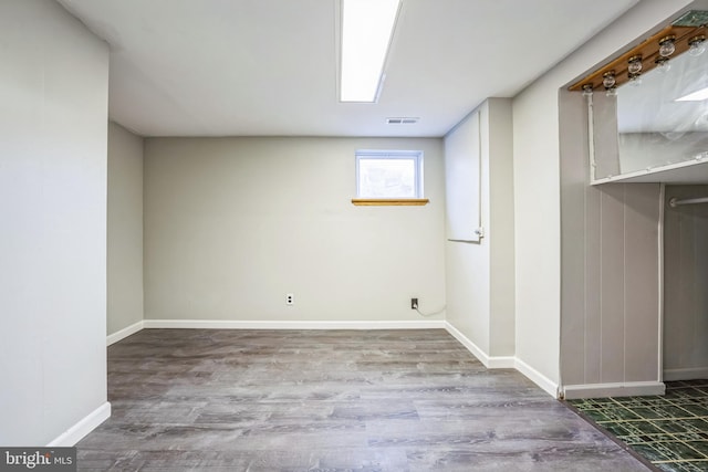 basement featuring hardwood / wood-style flooring