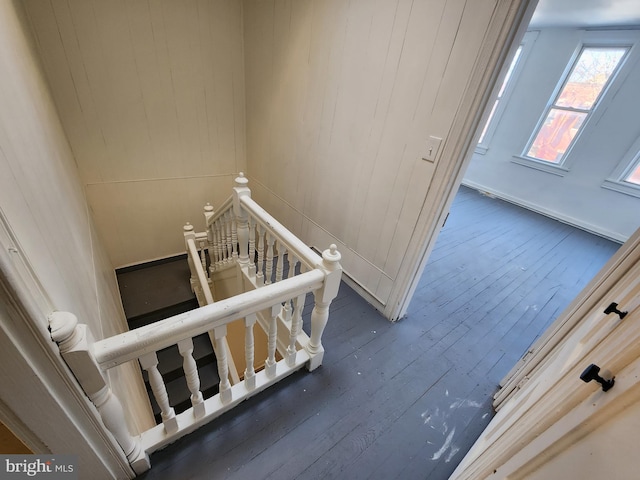 stairs with wood-type flooring