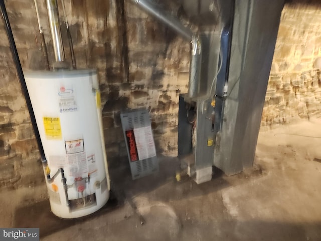 utility room featuring gas water heater