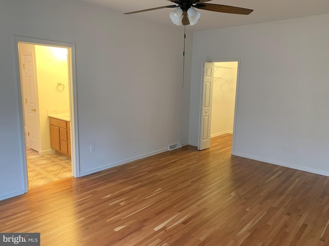 spare room featuring light wood-type flooring and ceiling fan