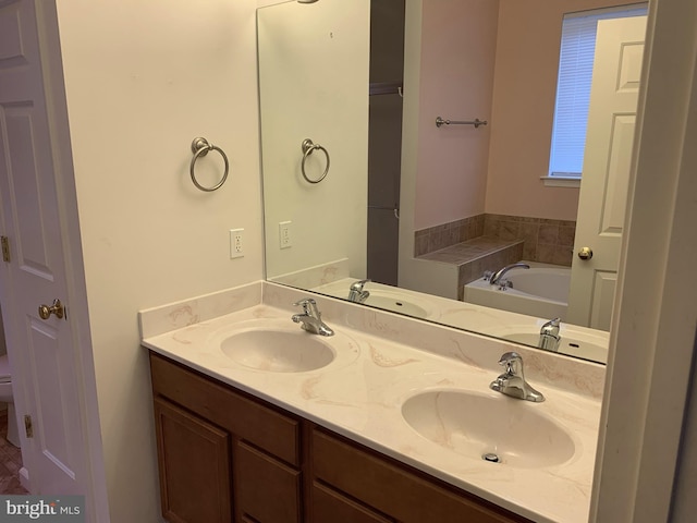 bathroom with a bathing tub and vanity