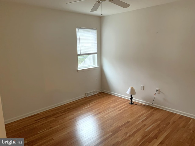 spare room featuring ceiling fan and light hardwood / wood-style floors