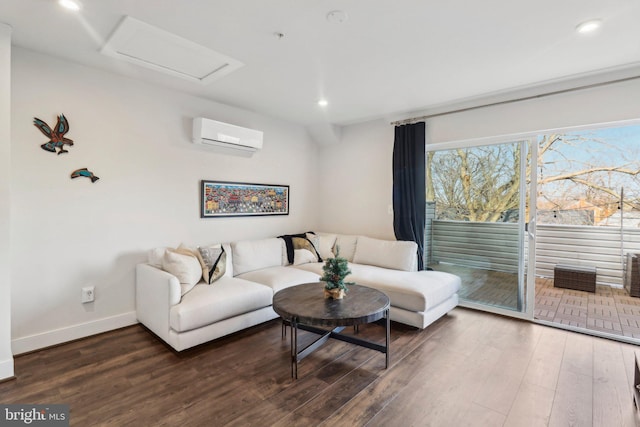 living room with dark wood-type flooring and a wall mounted AC