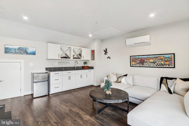 living room featuring a wall mounted air conditioner, dark hardwood / wood-style flooring, and wet bar