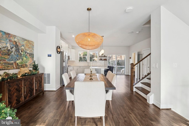 dining space featuring dark hardwood / wood-style flooring