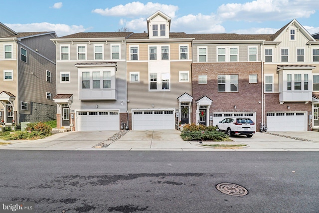 townhome / multi-family property featuring a garage