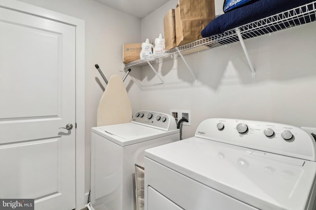 washroom with separate washer and dryer