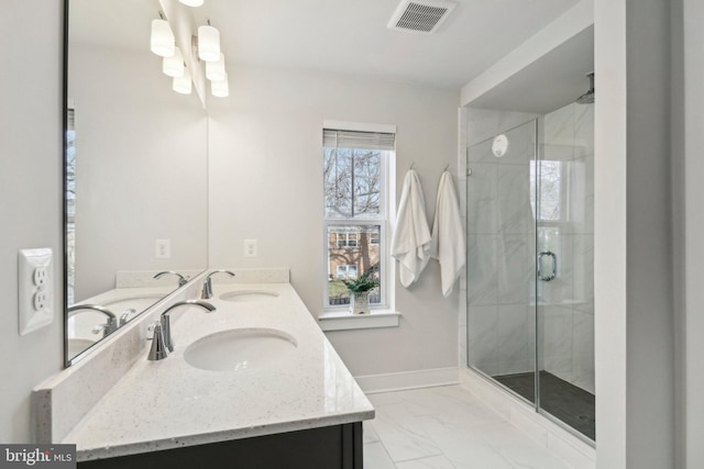 bathroom with vanity and an enclosed shower