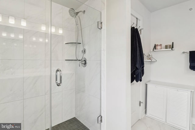 bathroom with a shower with shower door