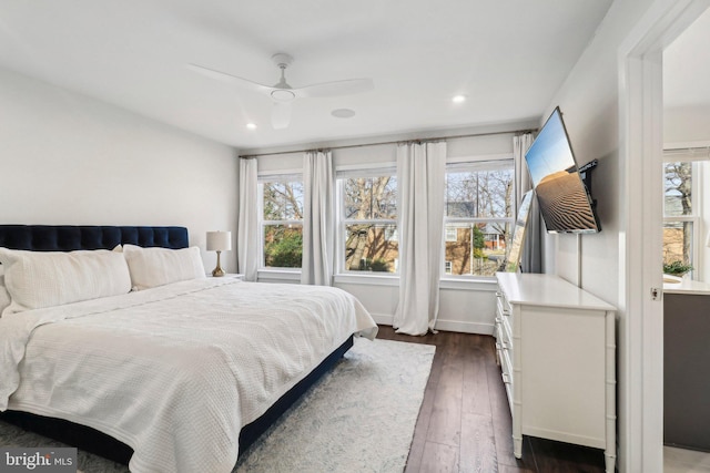 bedroom featuring ceiling fan and dark hardwood / wood-style flooring