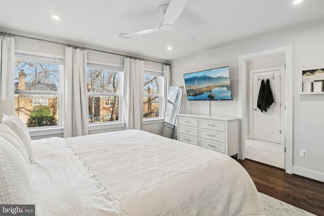 bedroom with a closet, ceiling fan, and dark hardwood / wood-style flooring