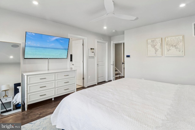 bedroom featuring ceiling fan and dark wood-type flooring