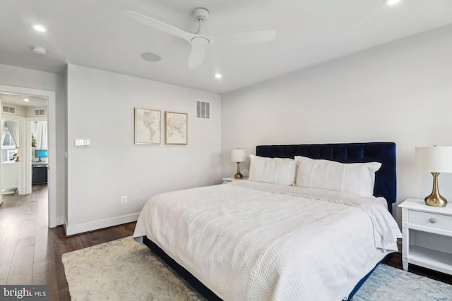 bedroom with ceiling fan and dark wood-type flooring