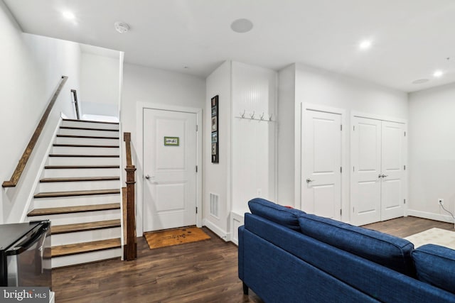 foyer entrance with dark hardwood / wood-style floors