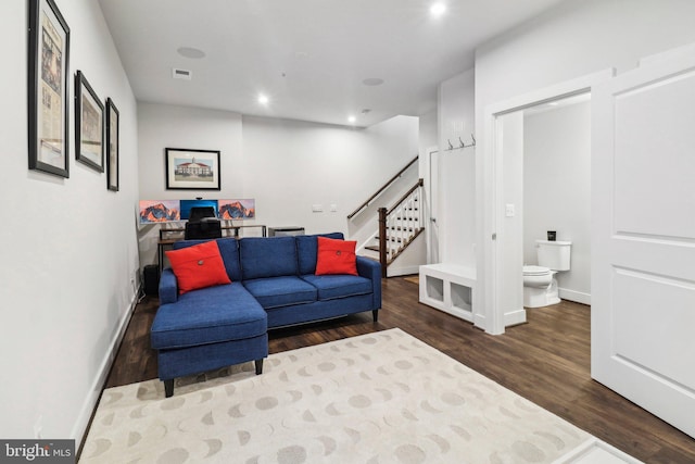 living room with dark hardwood / wood-style floors