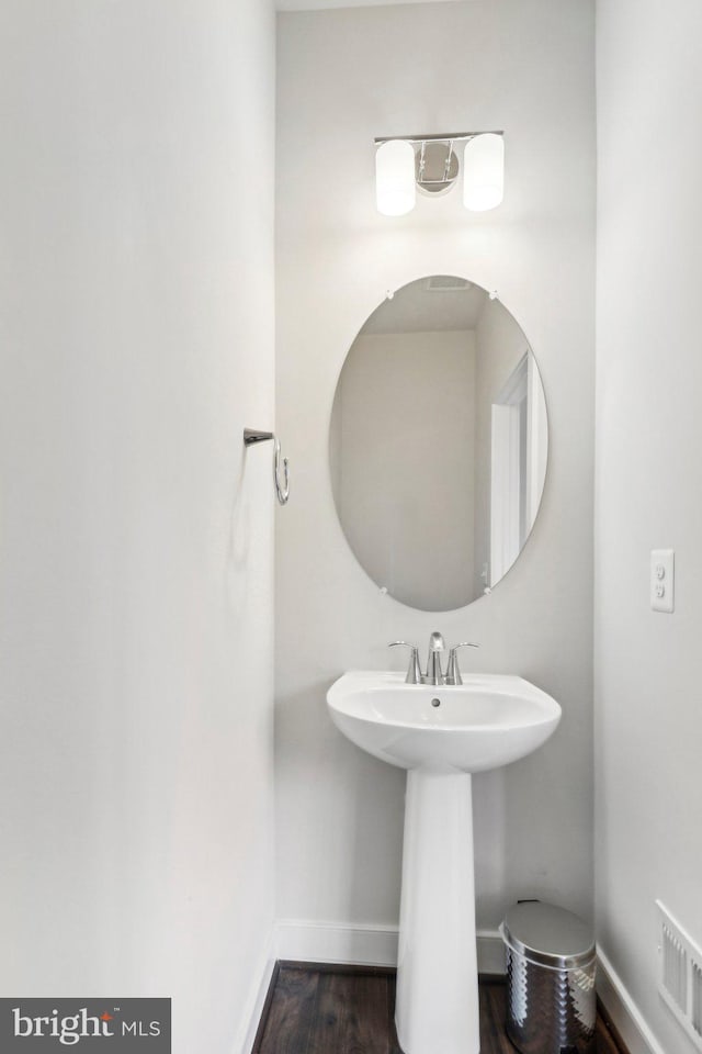 bathroom featuring wood-type flooring