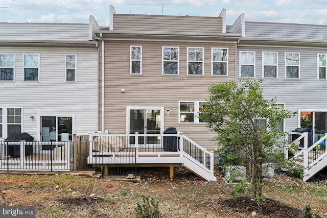 rear view of property with a deck