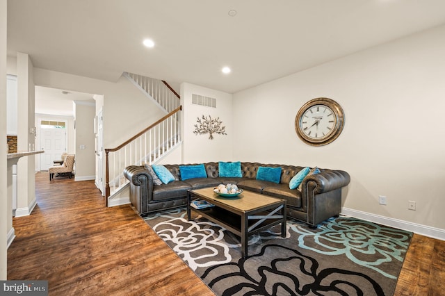 living room featuring dark hardwood / wood-style floors