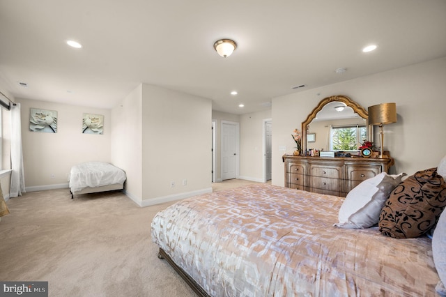 bedroom with light carpet