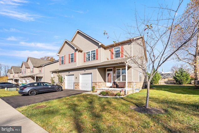 view of front of property with a front lawn and a garage