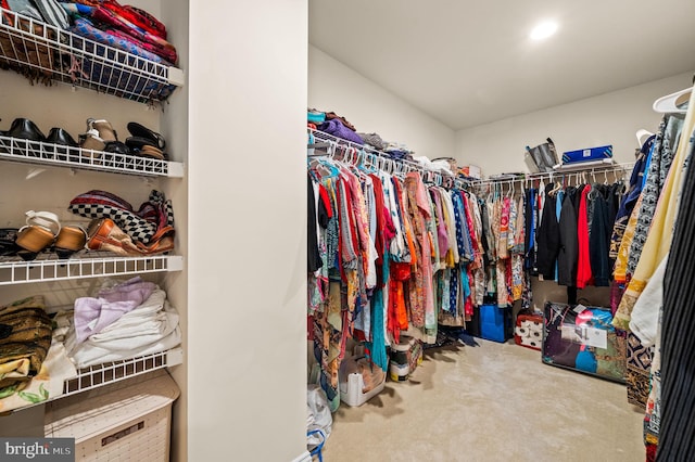 walk in closet featuring carpet