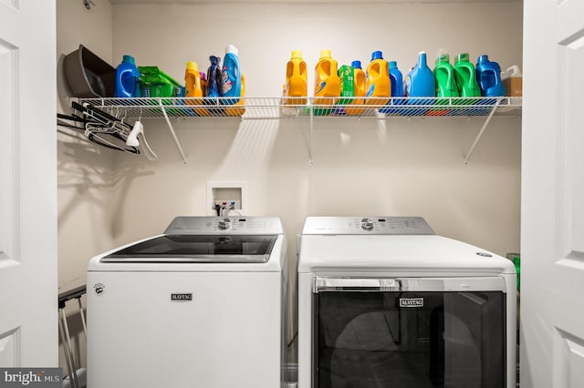 laundry area with separate washer and dryer