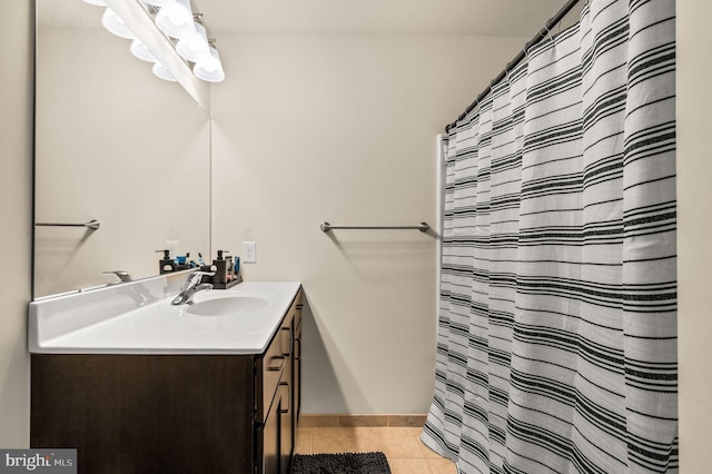 bathroom with tile patterned floors and vanity