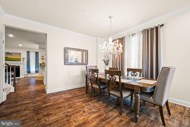 dining area featuring ornamental molding, dark wood-type flooring, and a chandelier