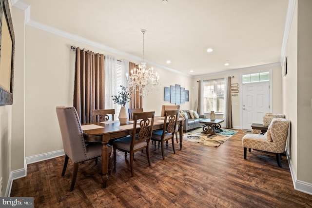 dining area with a chandelier, dark hardwood / wood-style flooring, and ornamental molding