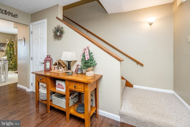 interior space with hardwood / wood-style floors and a textured ceiling